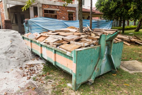 Waste disposal services trucks in West London